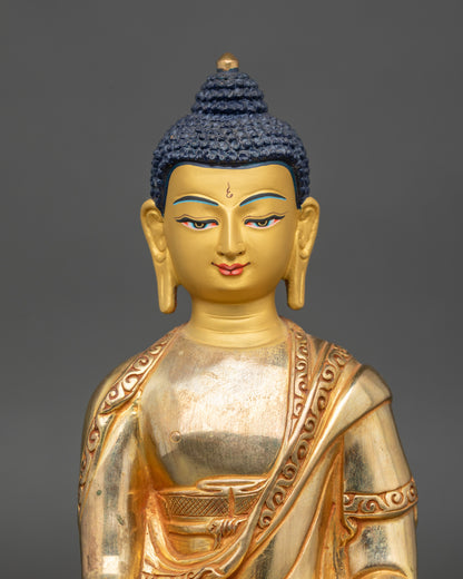 Regular close-up of Ratnasambhava statue showing intricate copper and gold craftsmanship