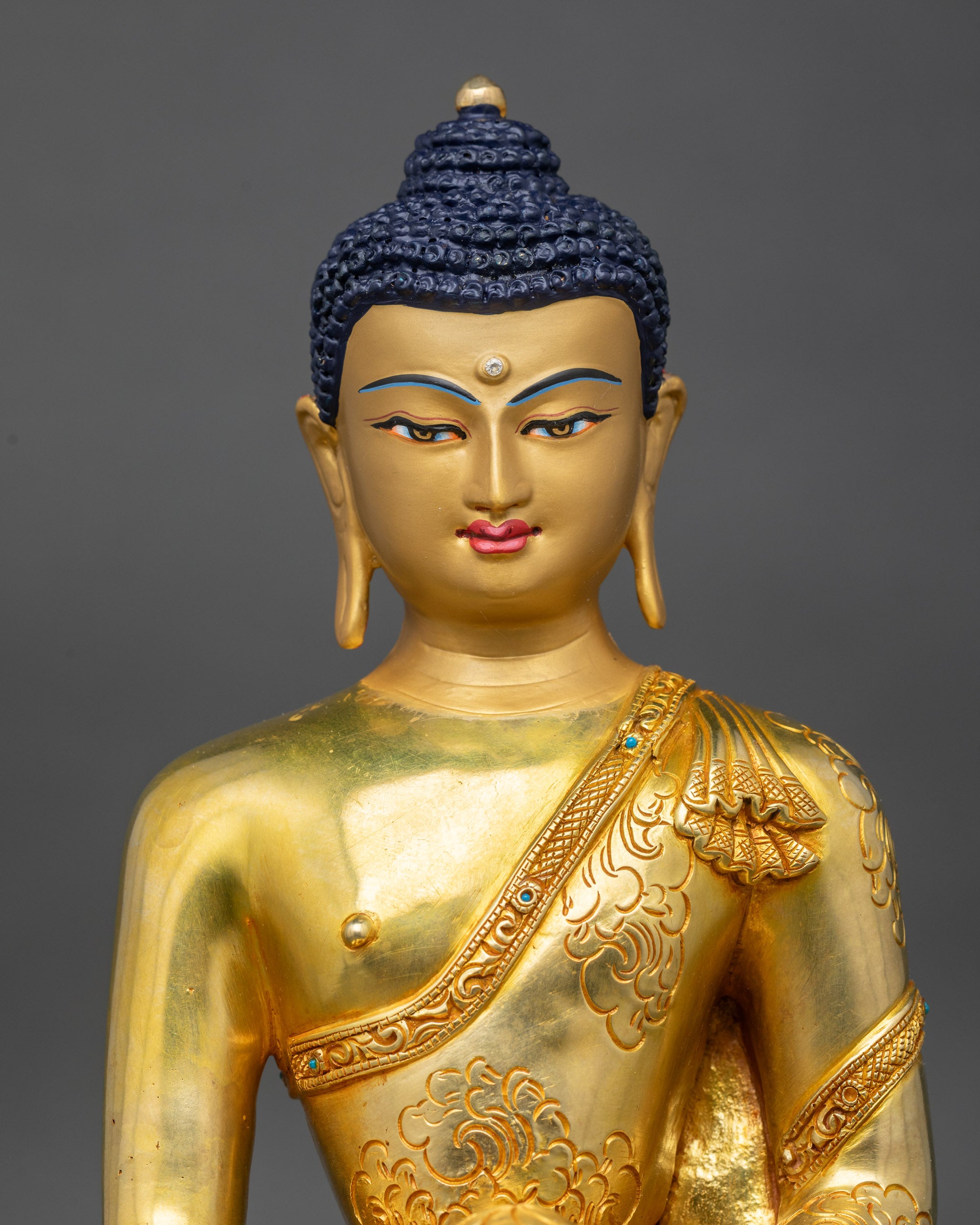 Regular close-up of Shakyamuni Buddha, showing begging bowl
