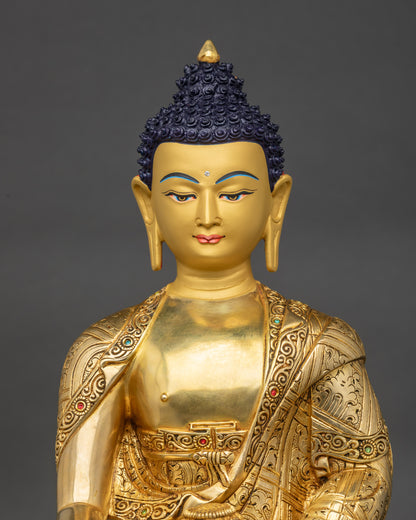 Regular close-up of Shakyamuni Buddha statue showing intricate lotus seat and robe details