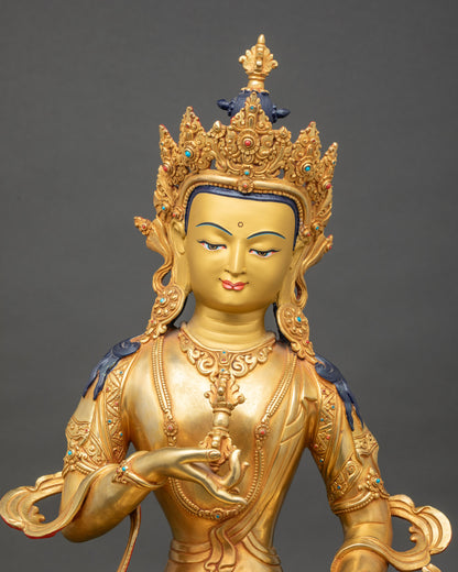 Regular close-up of Vajrasattva devotional statue, handcrafted copper with gold-painted face