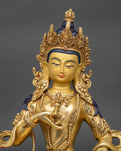 Regular close-up of Vajrasattva idol showing intricate robes and lotus seat details