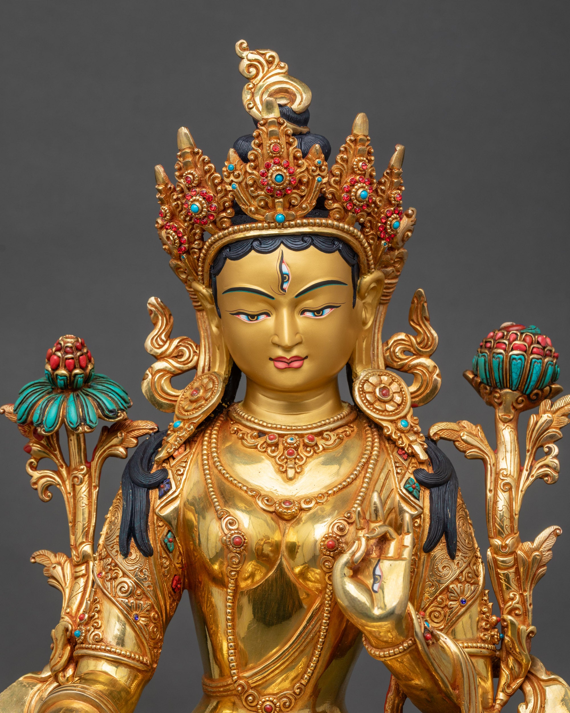 Regular close-up of White Tara statue showing copper alloy details and gold finish