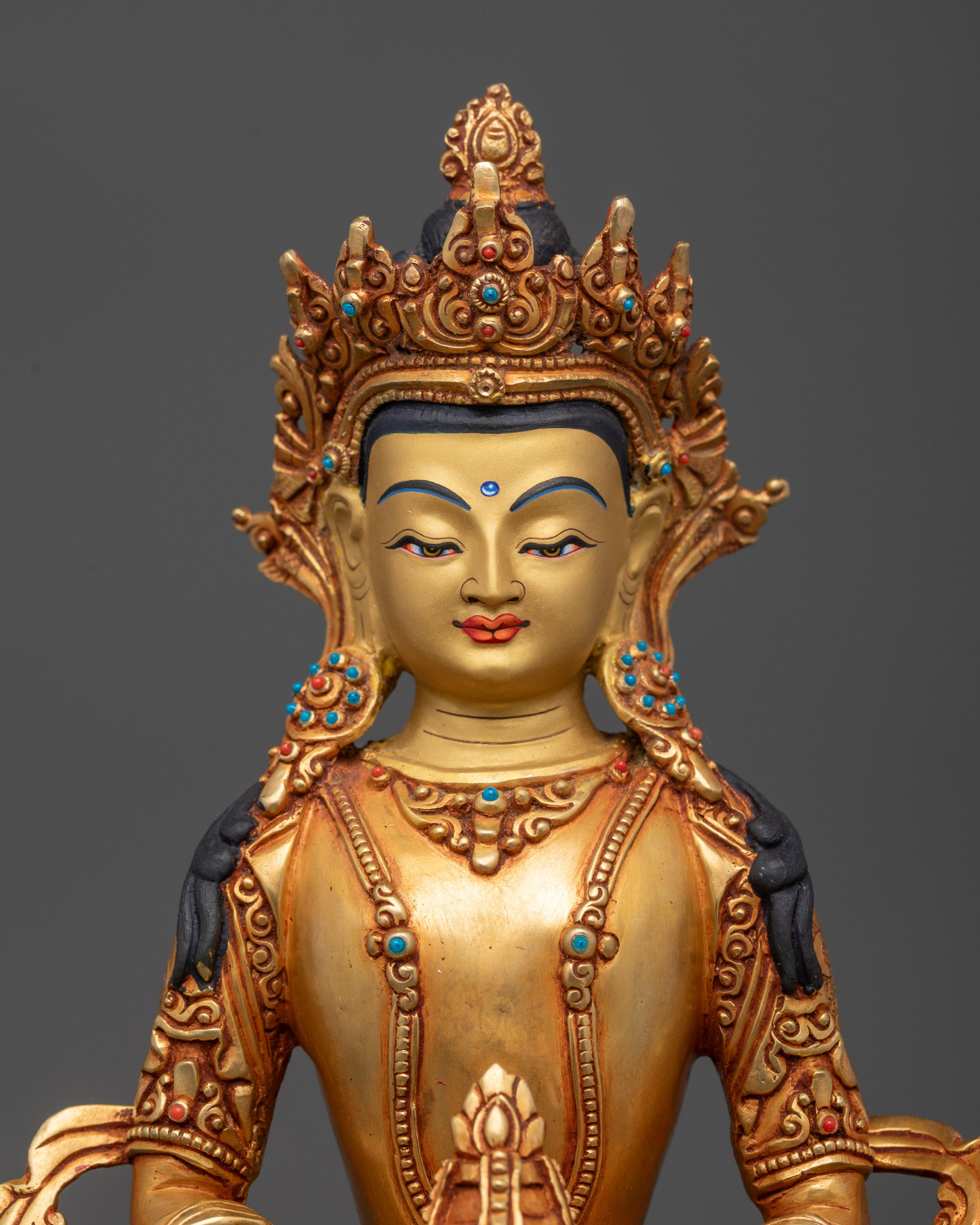 Regular close up Amitayus statue showing intricate robe, crown, and jewelry details
