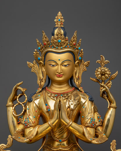 Regular close up Chenrezig statue showing flowing robes and four arms
