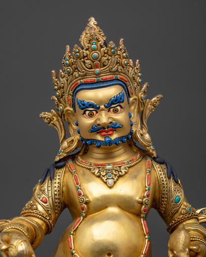 Regular close up Dzambhala Statue showing wrathful gold-gilded face and jewelry details