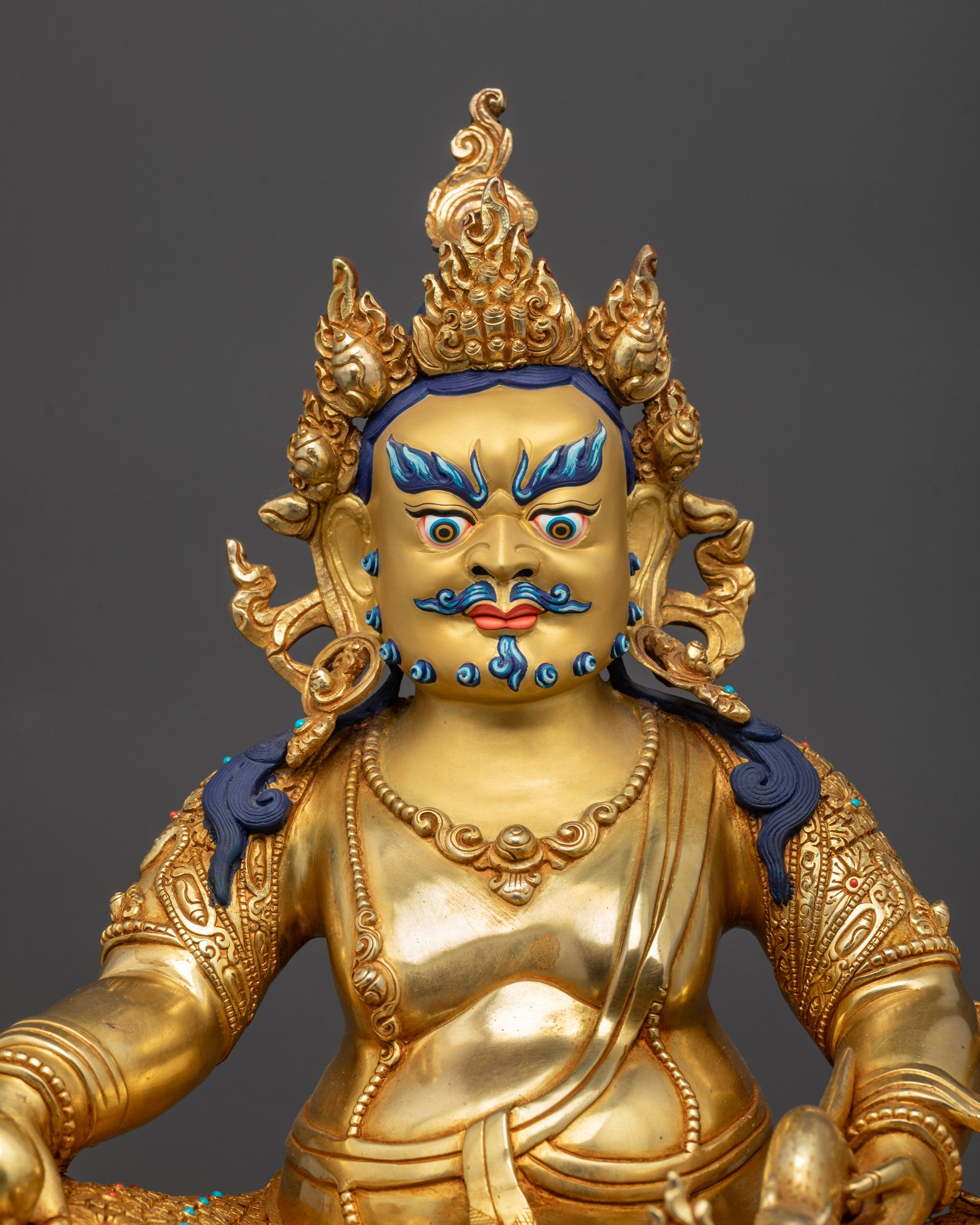 Regular close up Dzambhala holding citrons and jewels, mongoose spitting
