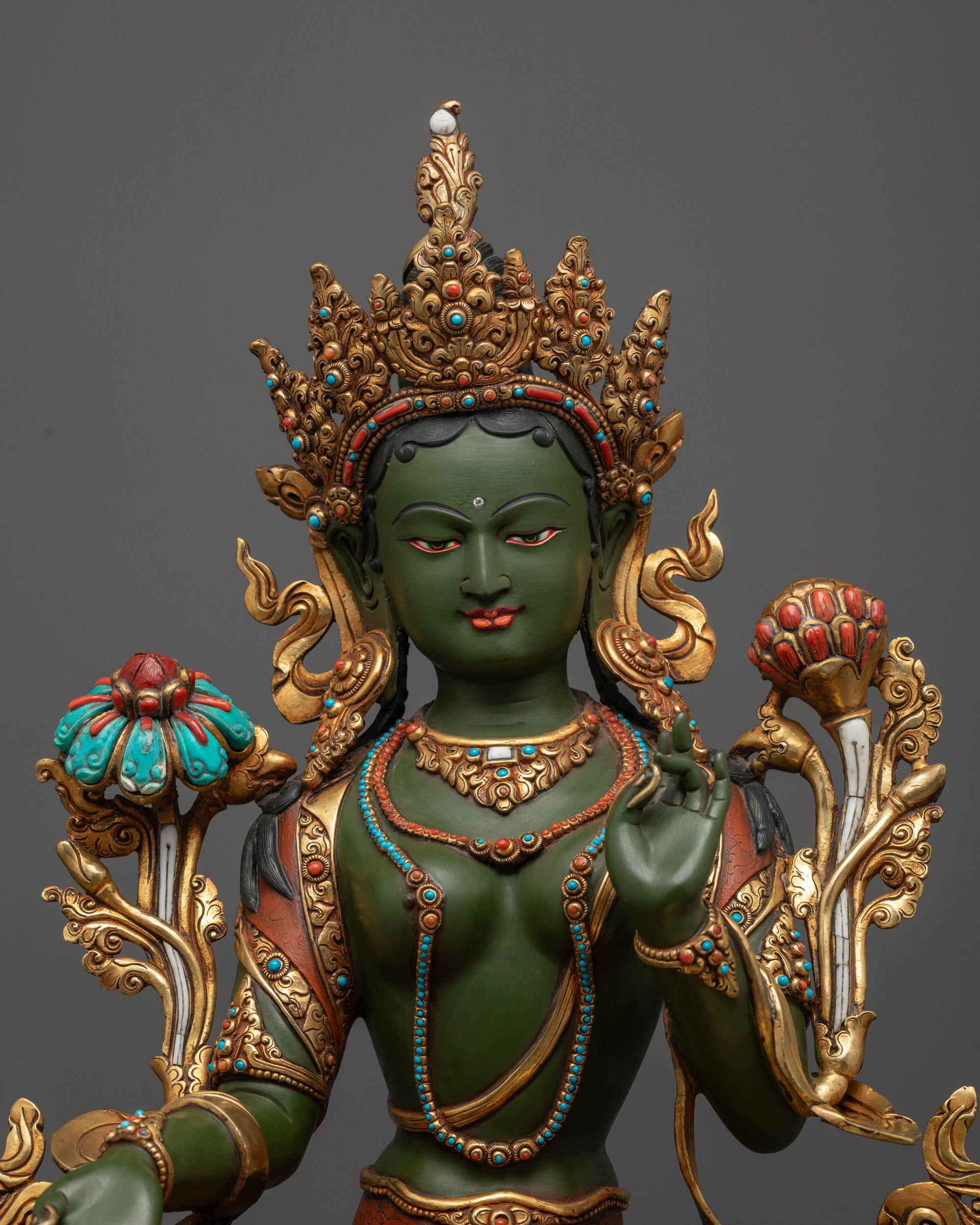 Regular close up Green Tara holding utpala flower with Varada Mudra
