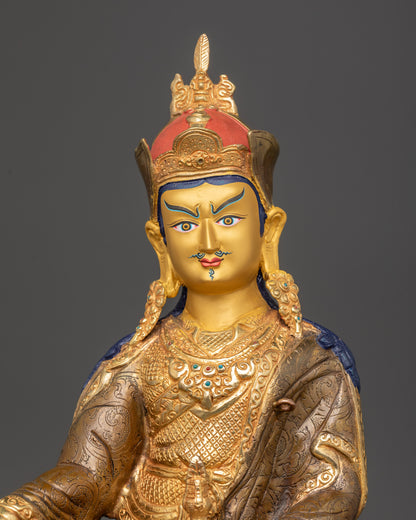 Regular close up Guru Padmasambhava statue showing kasaya robe and lotus hat details
