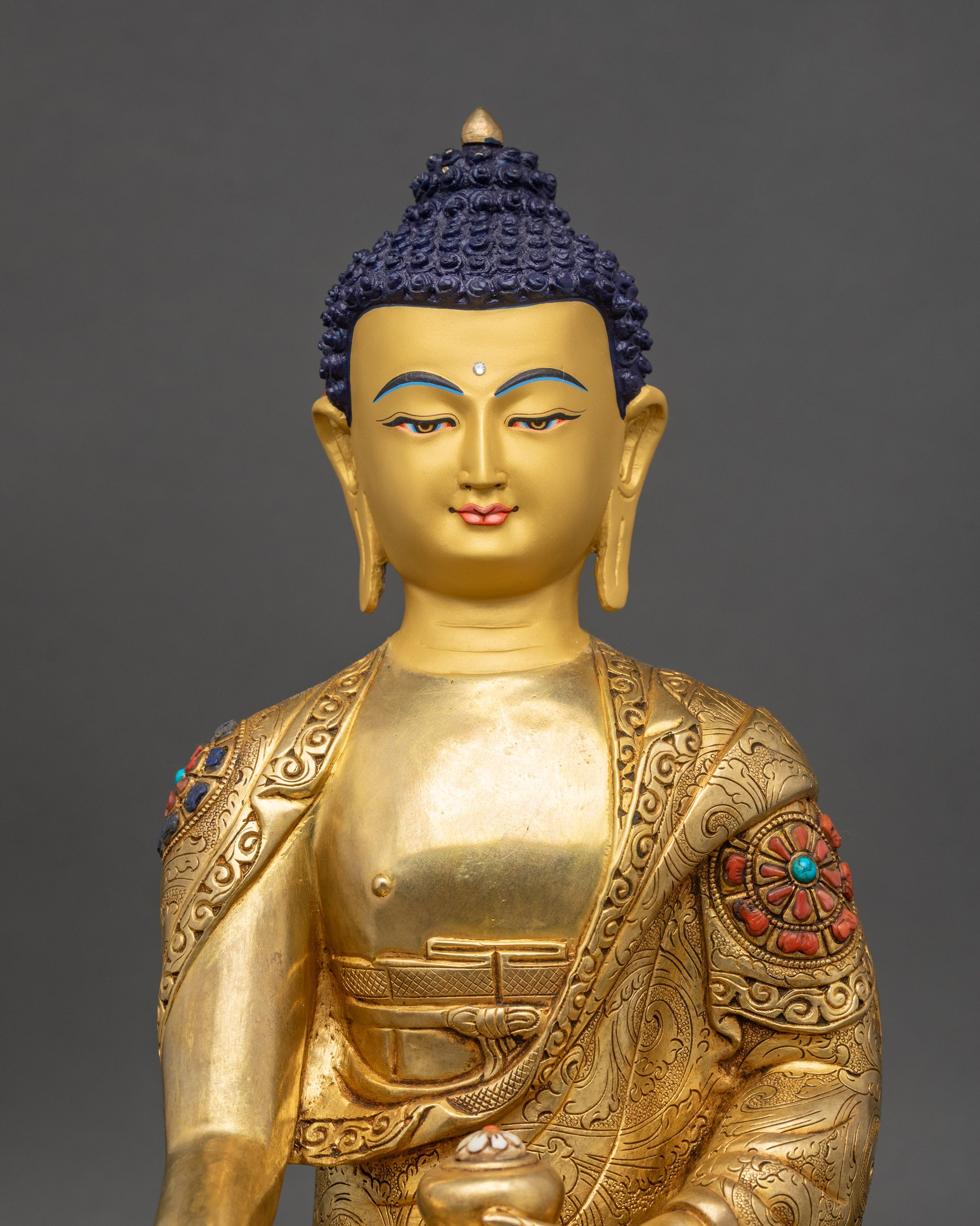 Regular close up Shakyamuni Buddha Statue showing meditative posture and lotus seat