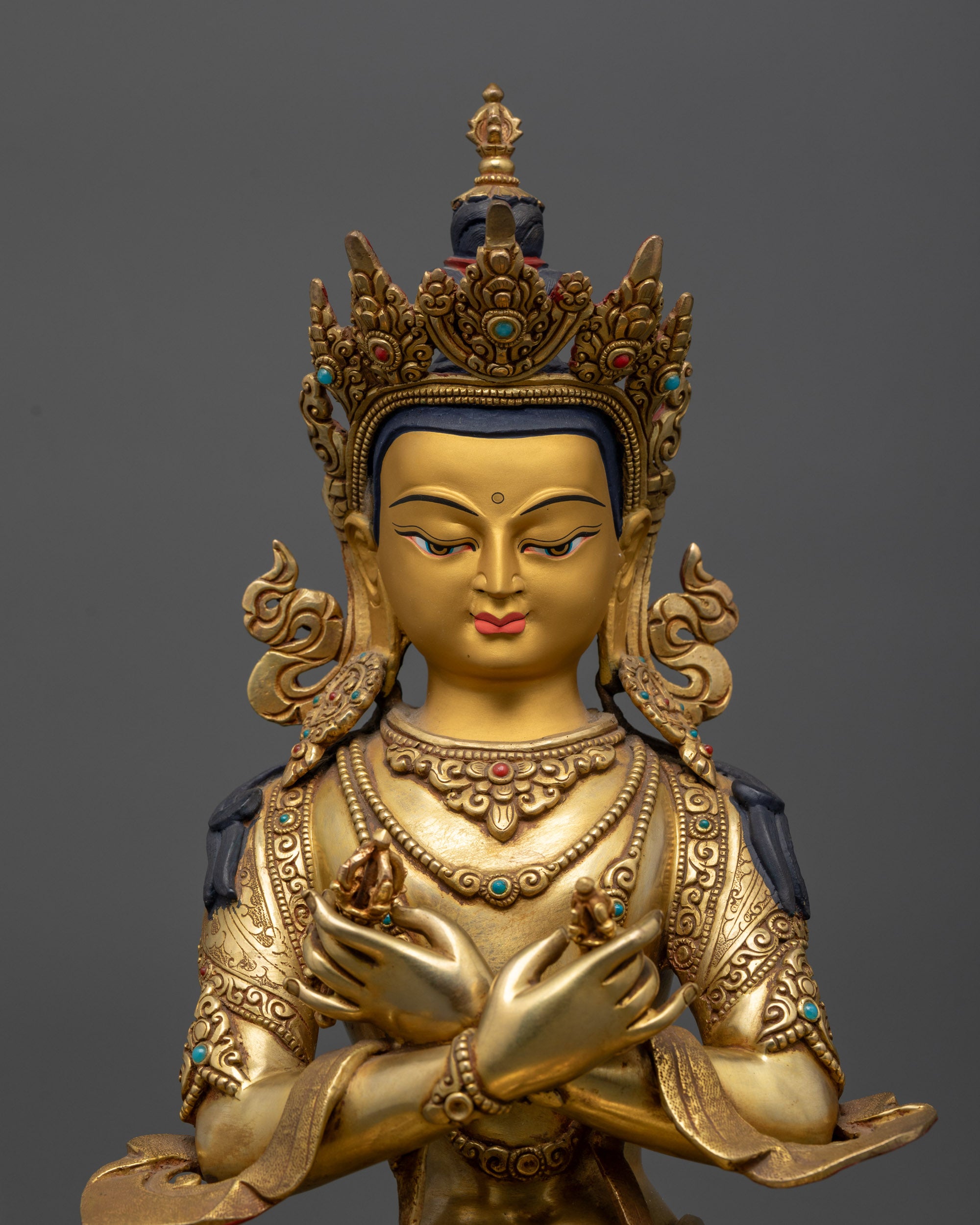 Regular close up Vajradhara Buddha statue showing calm expression and floating robe
