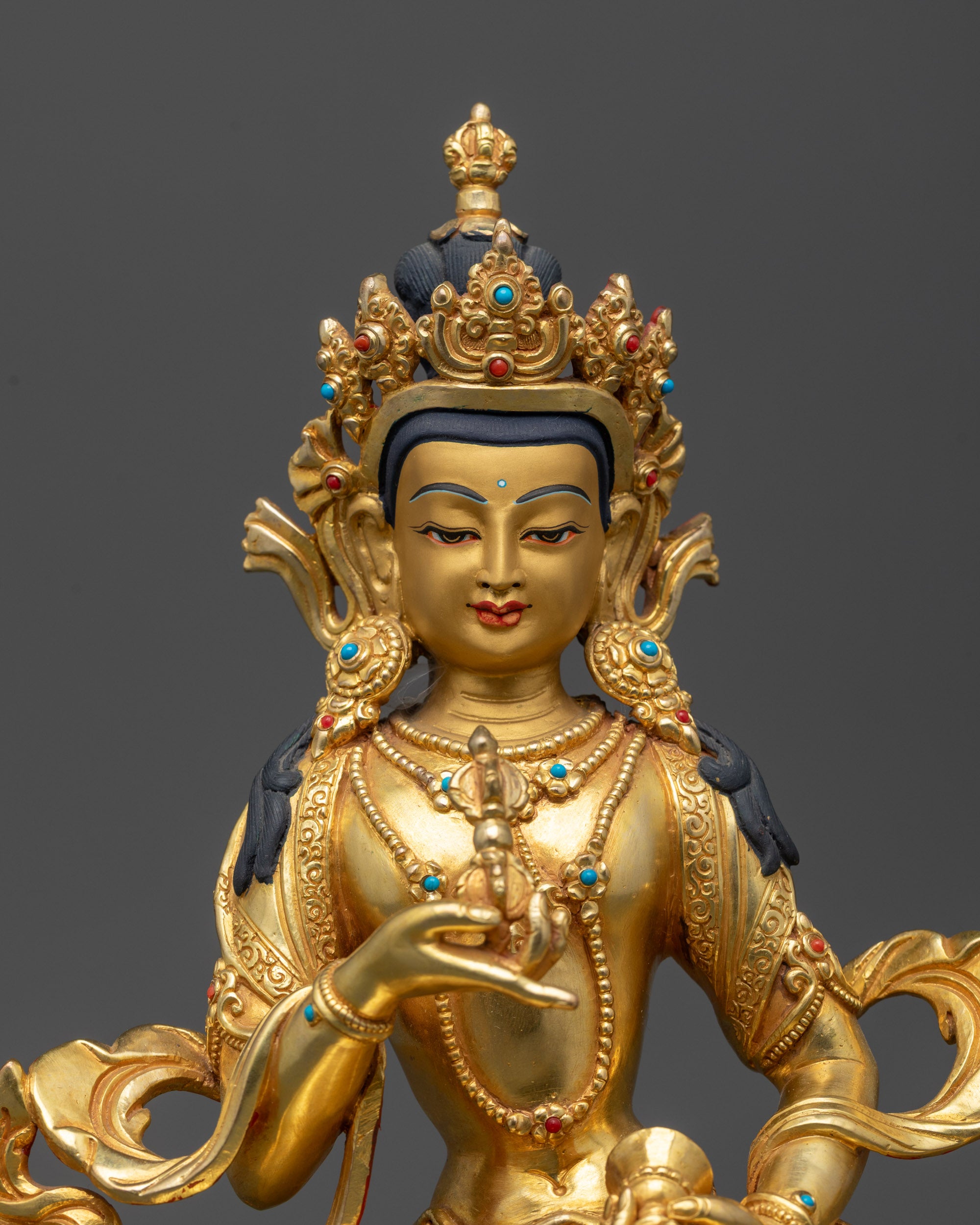 Regular close up Vajrasattva statue showing calm expression and flowing robe