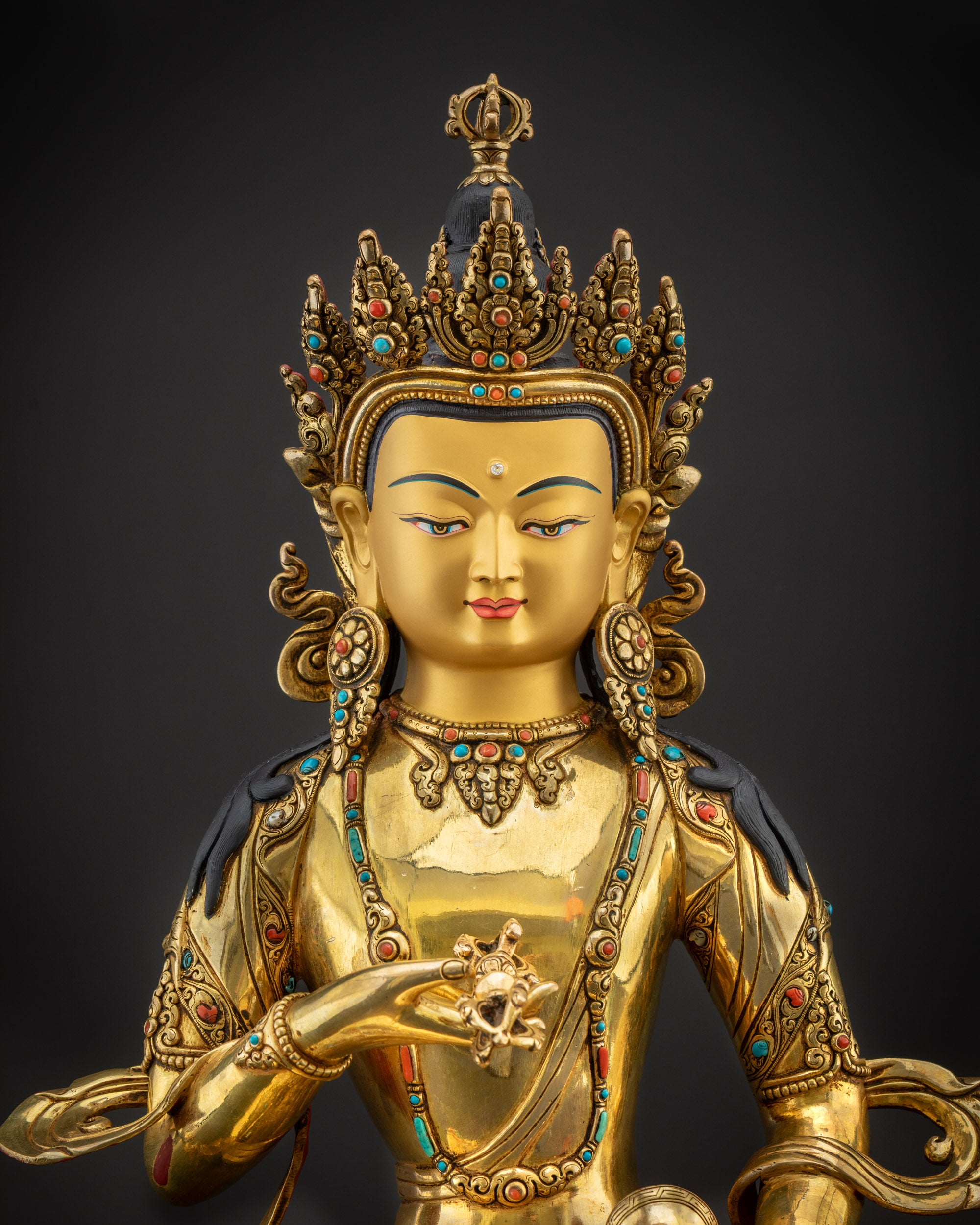 Regular close up Vajrasattva statue showing crown, halo and semi precious stone details