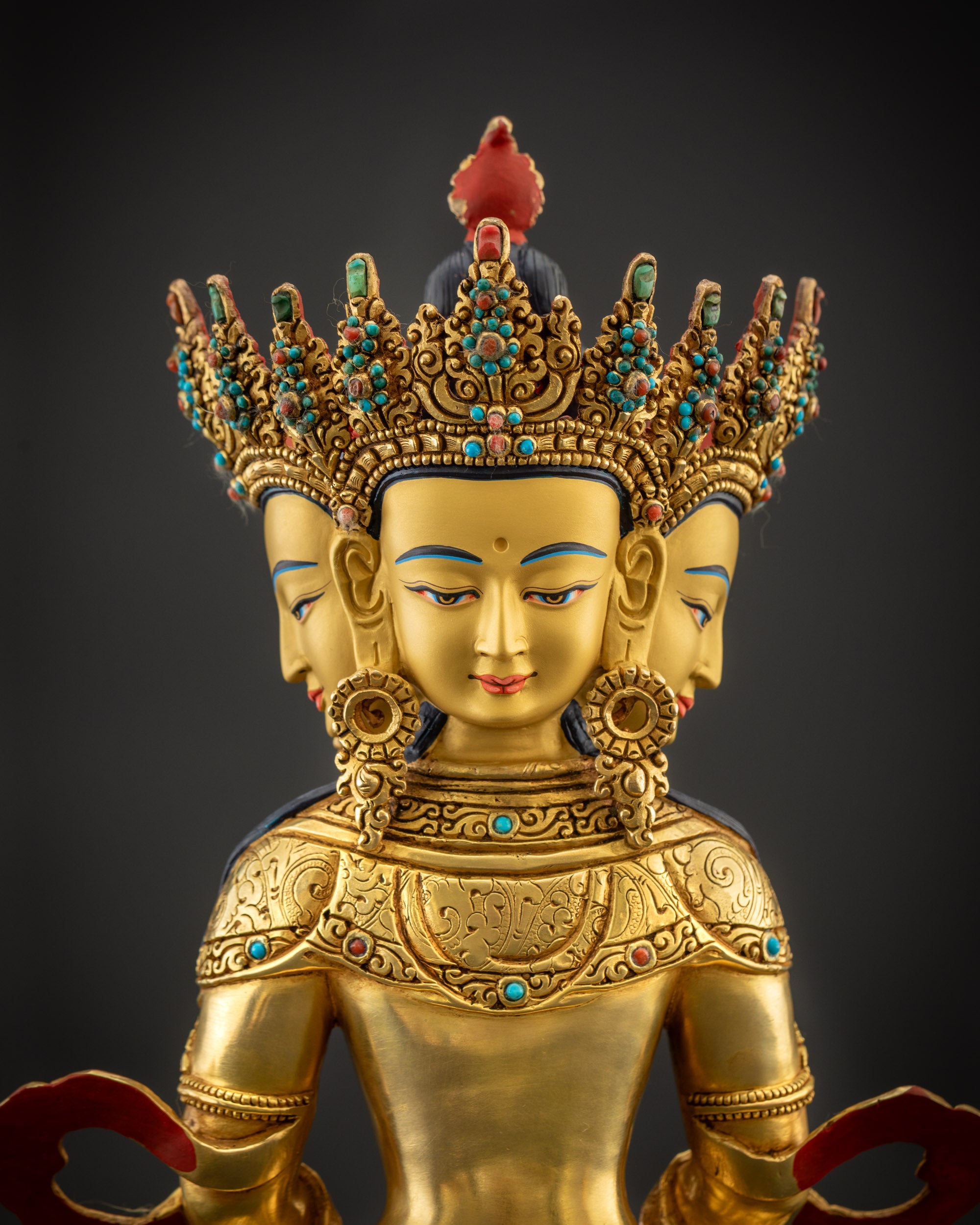 Regular close up back Primordial Vairocana Buddha statue showing crown, earrings, and robe details