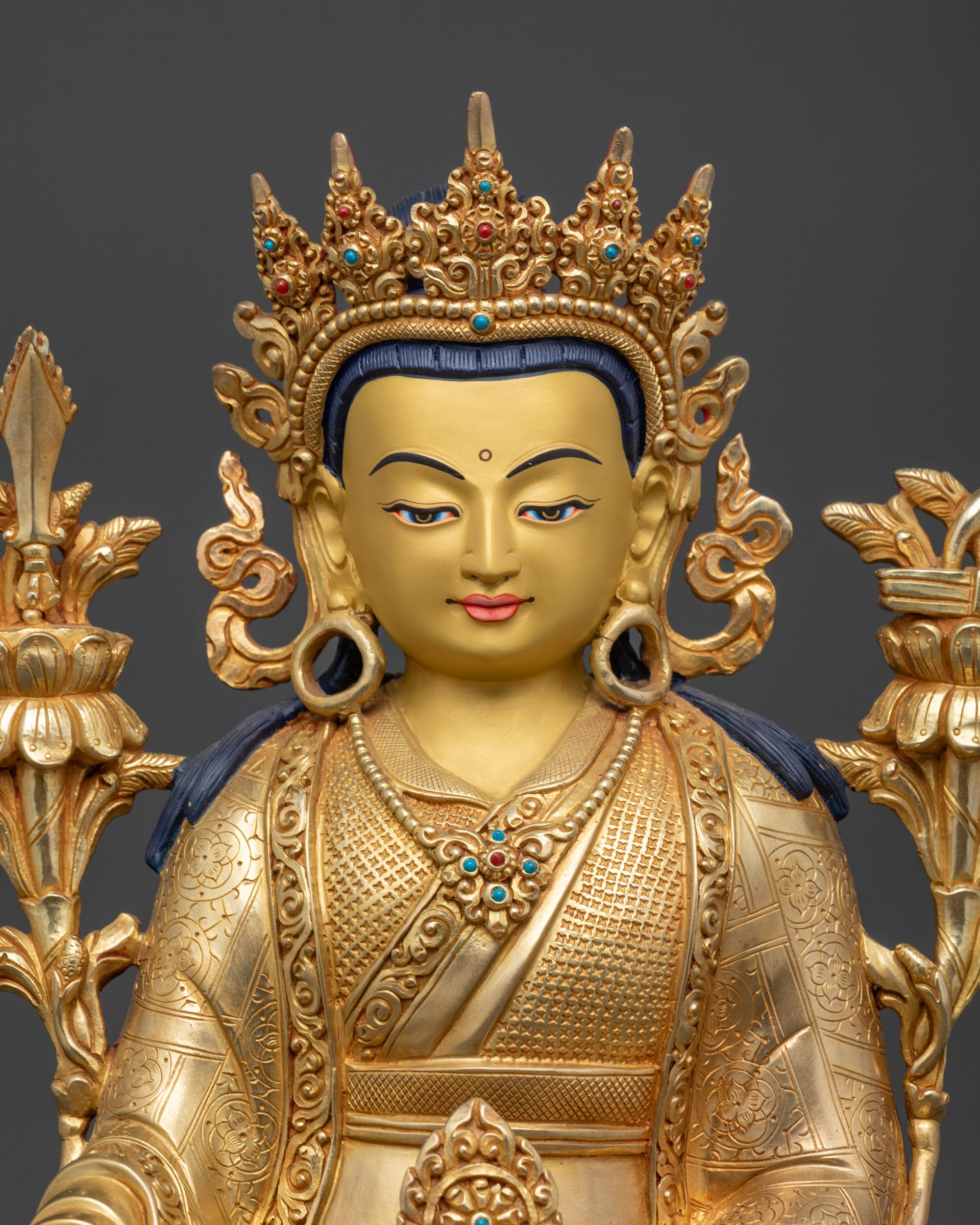 Regular close up handcrafted Nepalese Trisong Detsen statue with crown and jewelry
