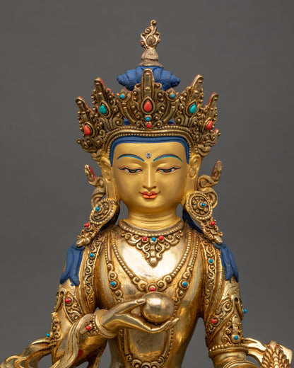 Regular close up of Ksitigarbha statue showing crown robe and semi-precious stones details