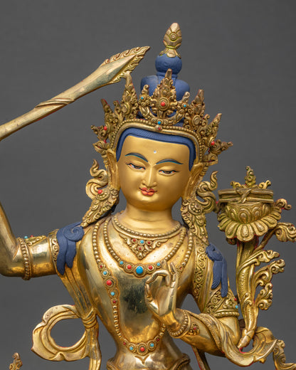 Regular close up of Manjushri Bodhisattva statue showing intricate swirling robes
