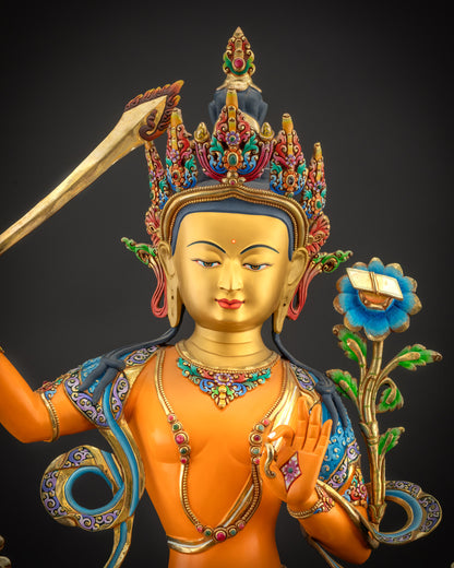 Regular close up of Manjushri statue highlighting hand-painted robes and floral motifs
