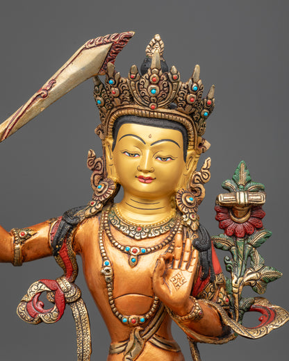 Regular close up of Manjushri statue showing serene expression and intricate patterns
