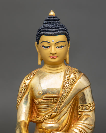 Regular close up of Shakyamuni Buddha Figure showing gold-gilded copper and polished finish
