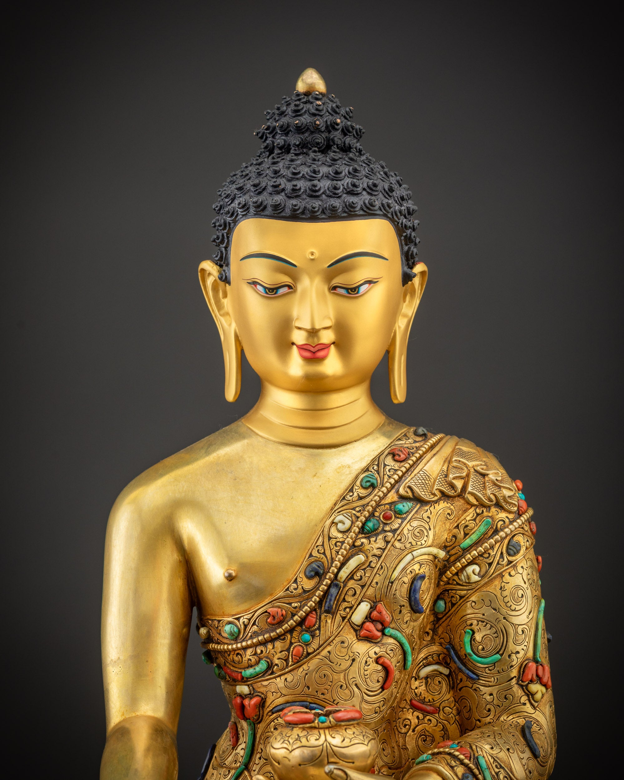 Regular close up of Shakyamuni Buddha statue highlighting peaceful expression and details
