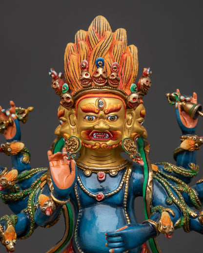 Regular close up of Ucchusma deity statue holding symbolic ritual objects
