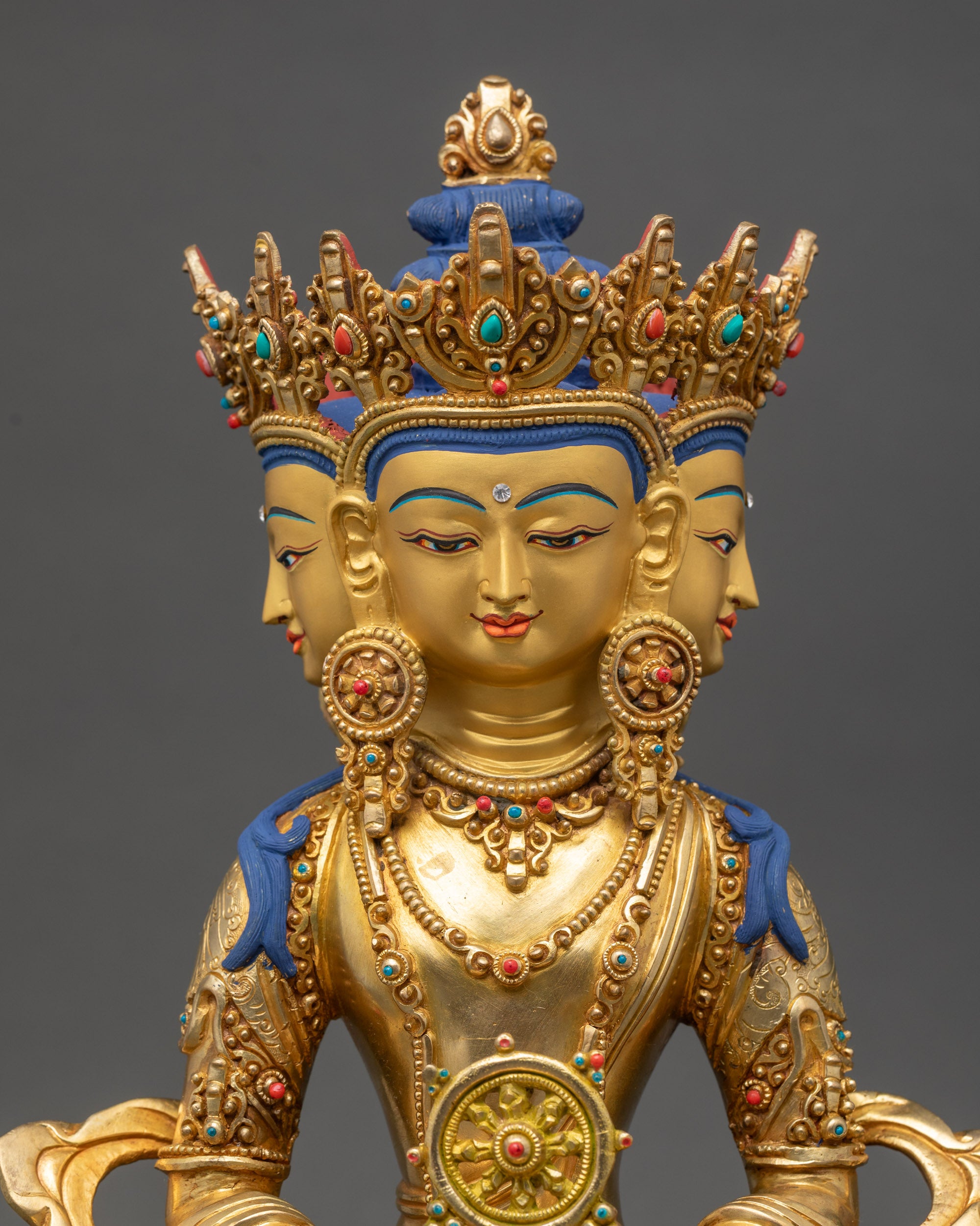 Regular close up of Vairocana Buddha sculpture showing intricate floral robe and jewelry patterns