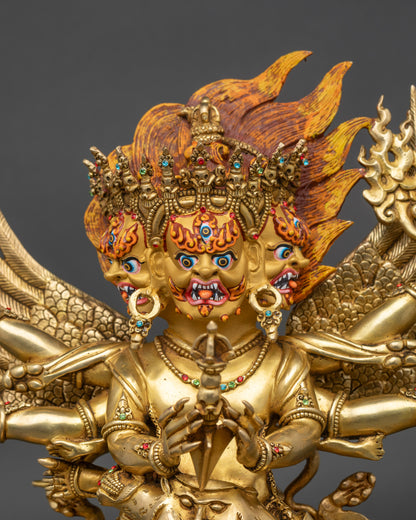 Regular close up of Vajrakilaya statue showing intricate gold fire-gilded copper work
