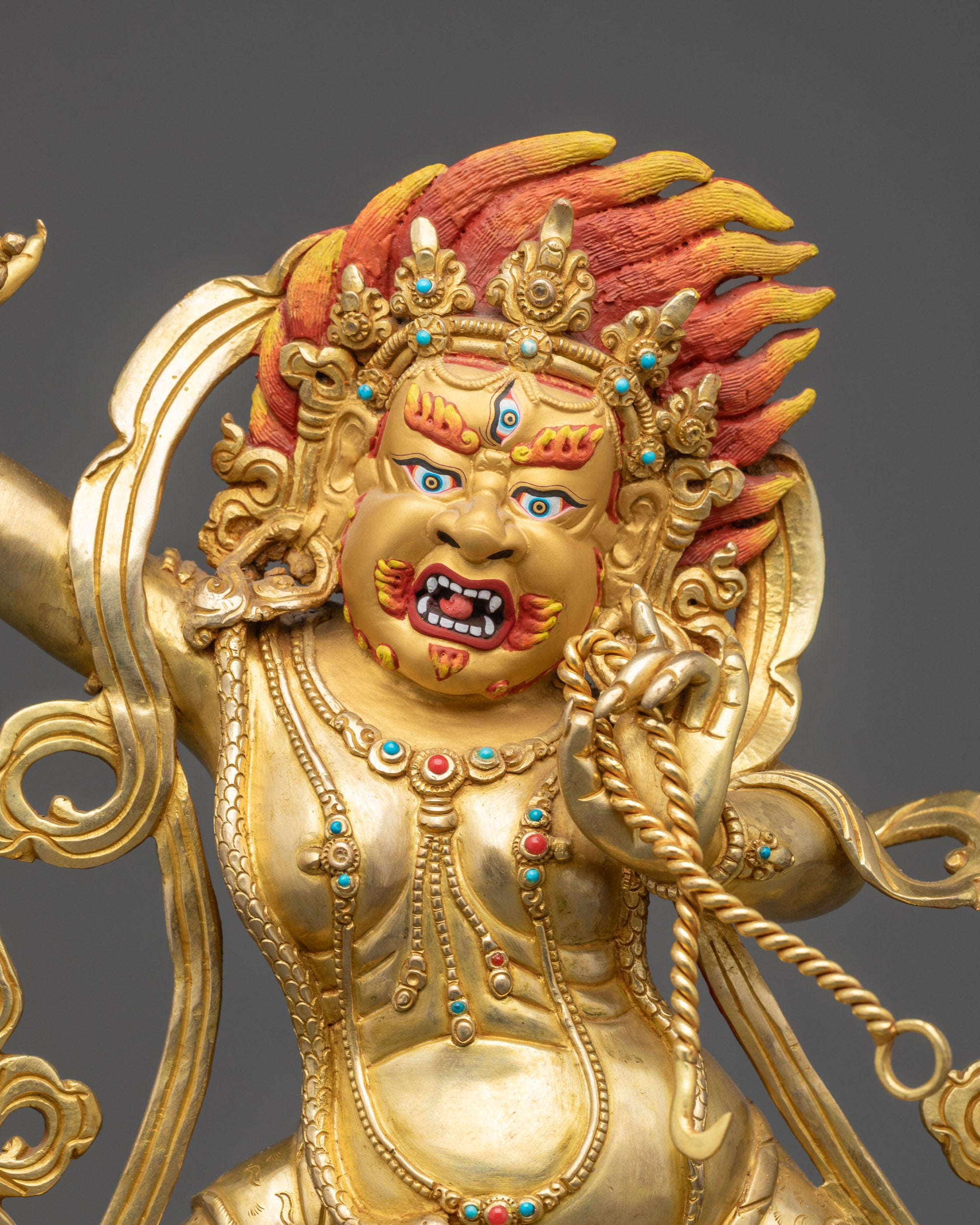 Regular close up of Vajrapani Sculpture showing wrathful expression and lotus base
