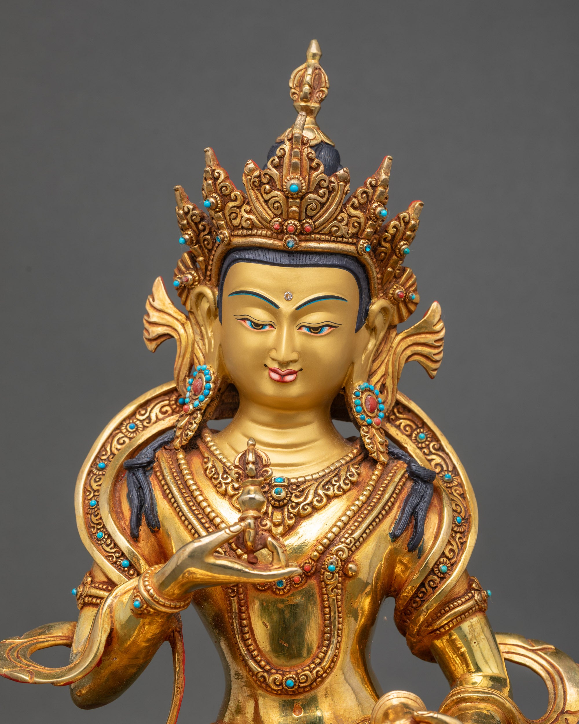 Regular close up of Vajrasattva Statue showing intricate semi-precious stones on robe