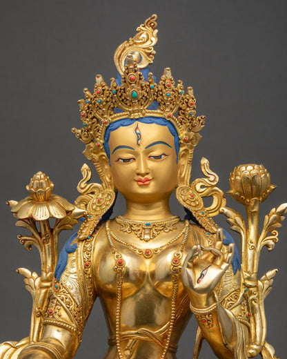 Regular close up of White Tara sculpture showing jeweled crown, utpala flower, and detailed carving
