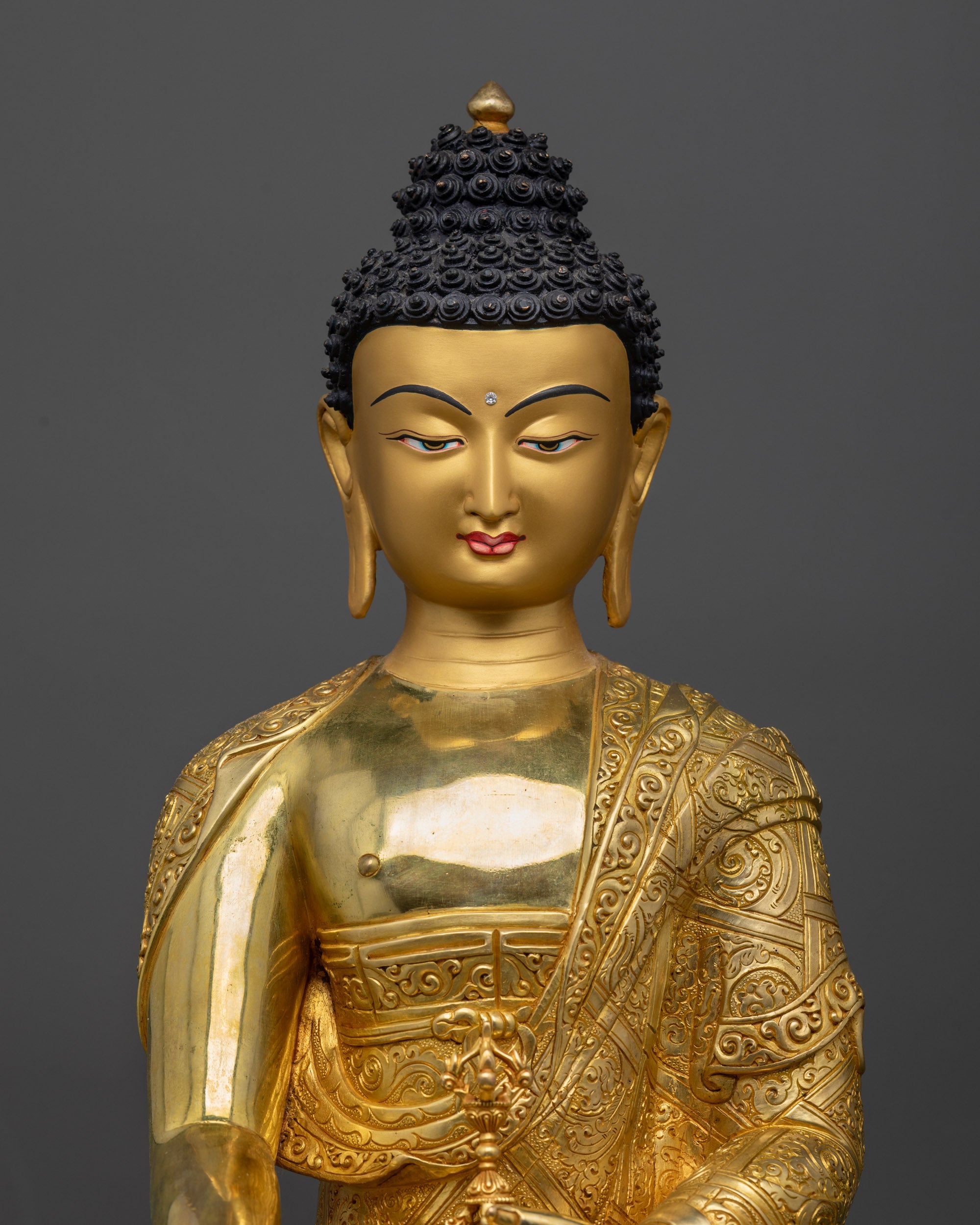 Regular close up of handcrafted Buddha Mitrugpa statue with 24K fire gold-gilded base

