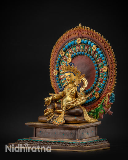 Regular left side view Dzambhala statue holding citron fruit with oxidized lower robes