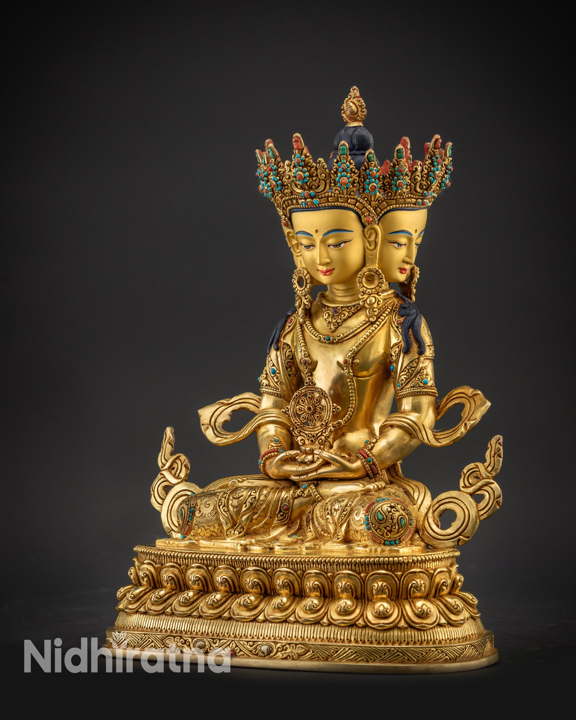 Regular left side view Vairocana Buddha statue highlighting semi-precious stone earrings and robe