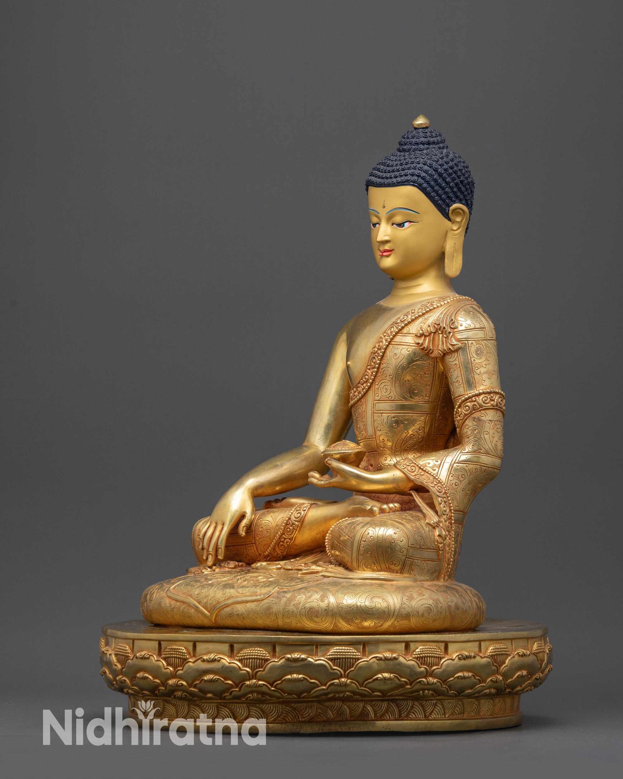 Regular left side view of Shakyamuni Buddha statue showing flowing robe patterns
