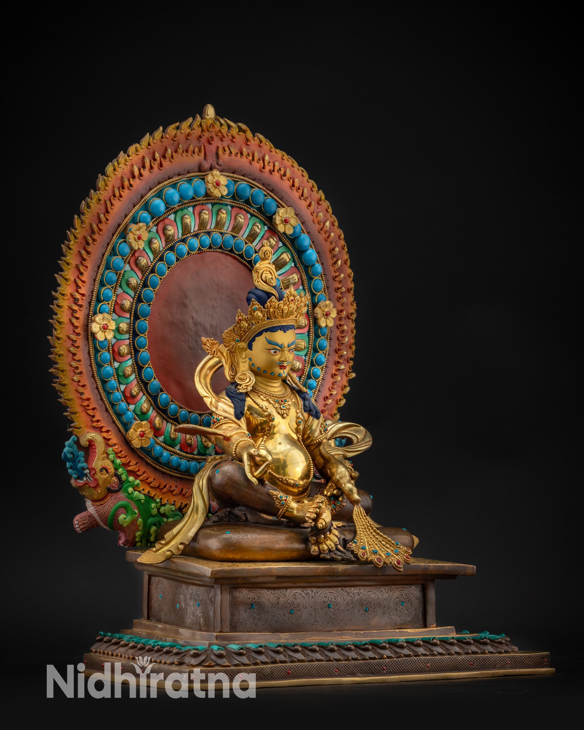 Regular right side view Dzambhala statue on lotus with jewel-spitting mongoose