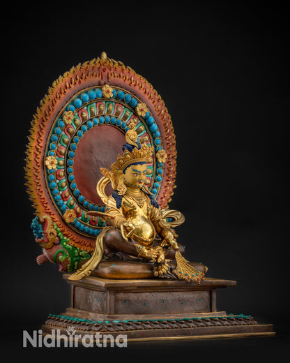 Regular right side view Dzambhala statue on lotus with jewel-spitting mongoose
