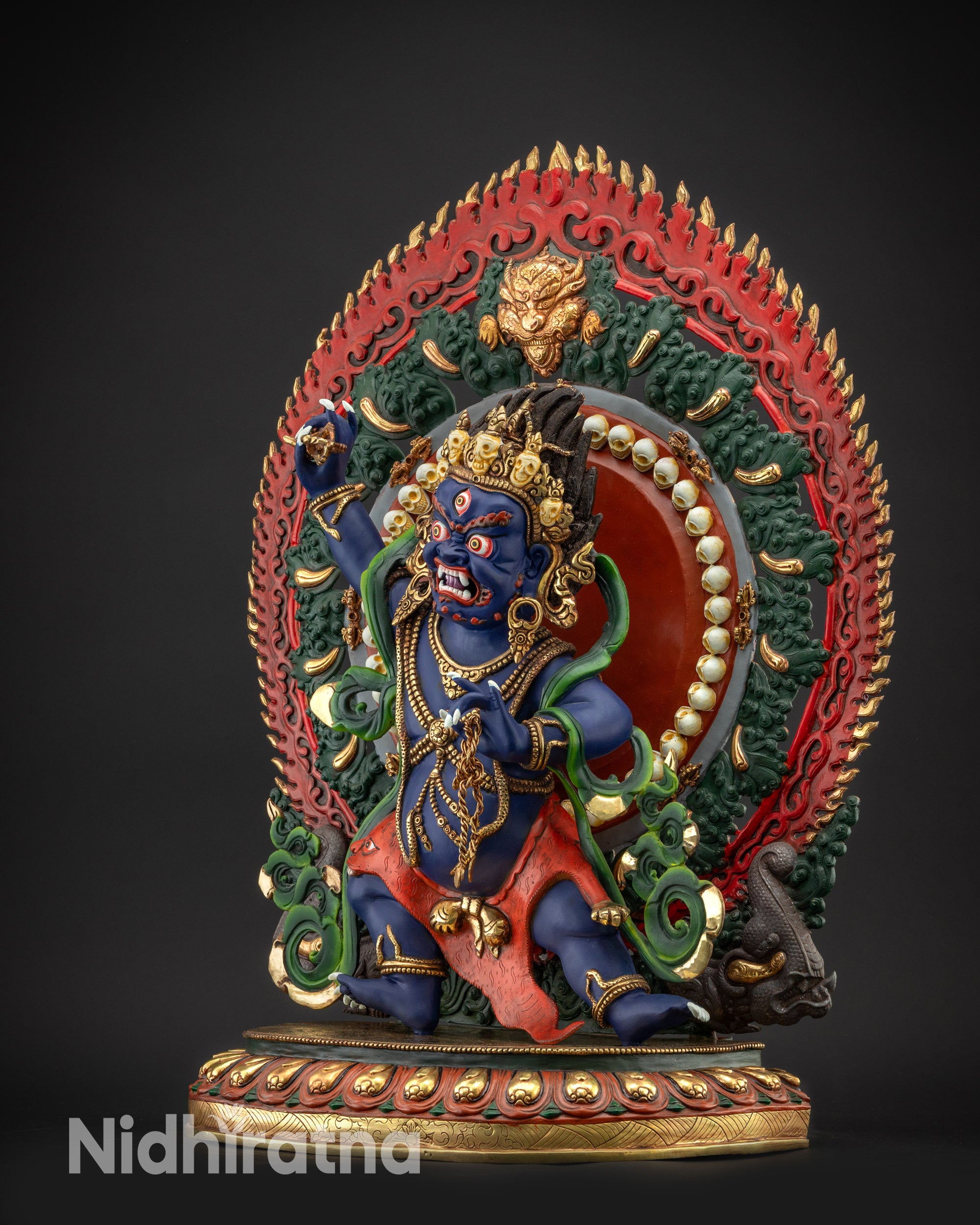 Regular right side view of Vajrapani statue showing serpent and swirling garments
