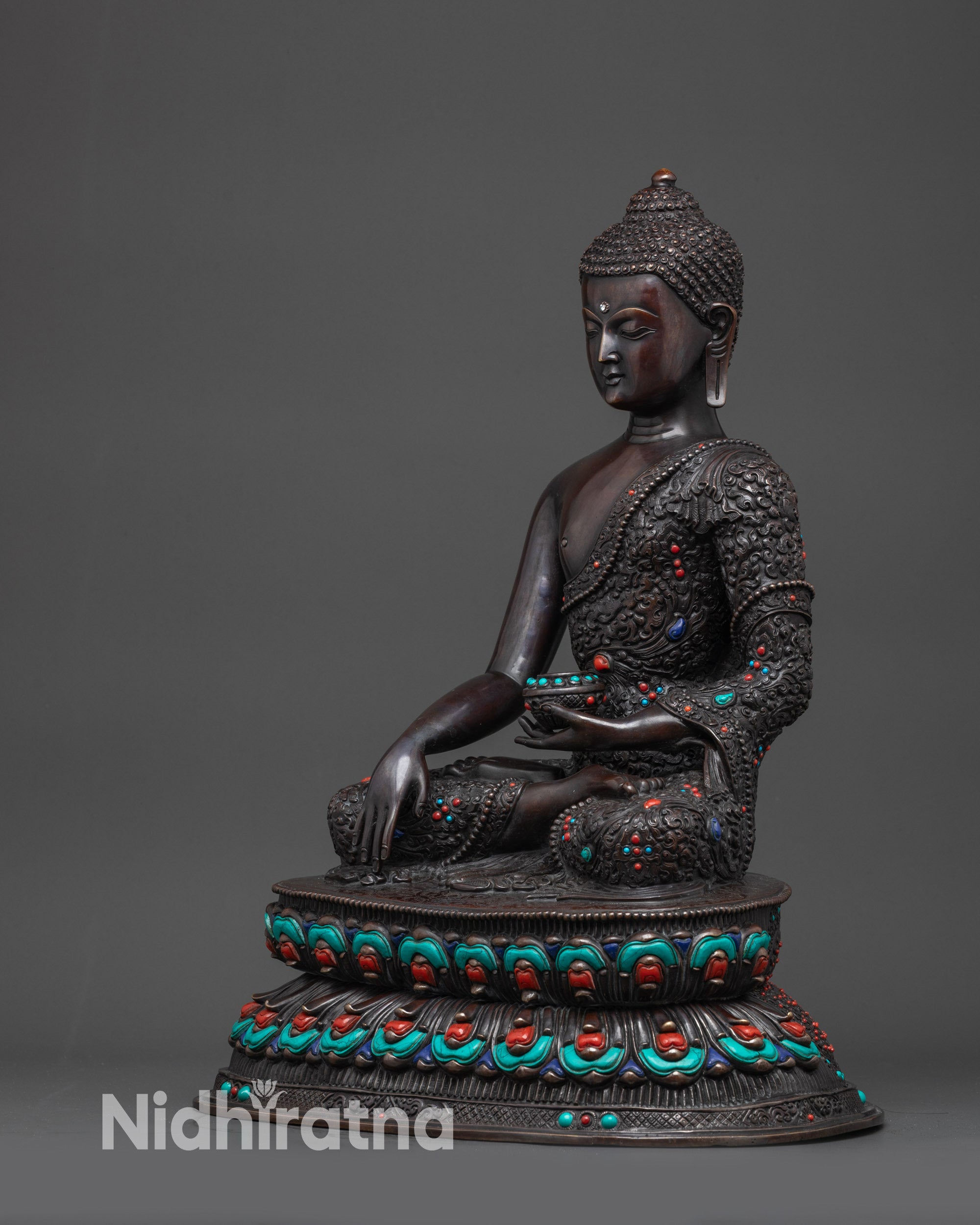 Regular side left Buddha Shakyamuni oxidized statue highlighting intricate floral motifs
