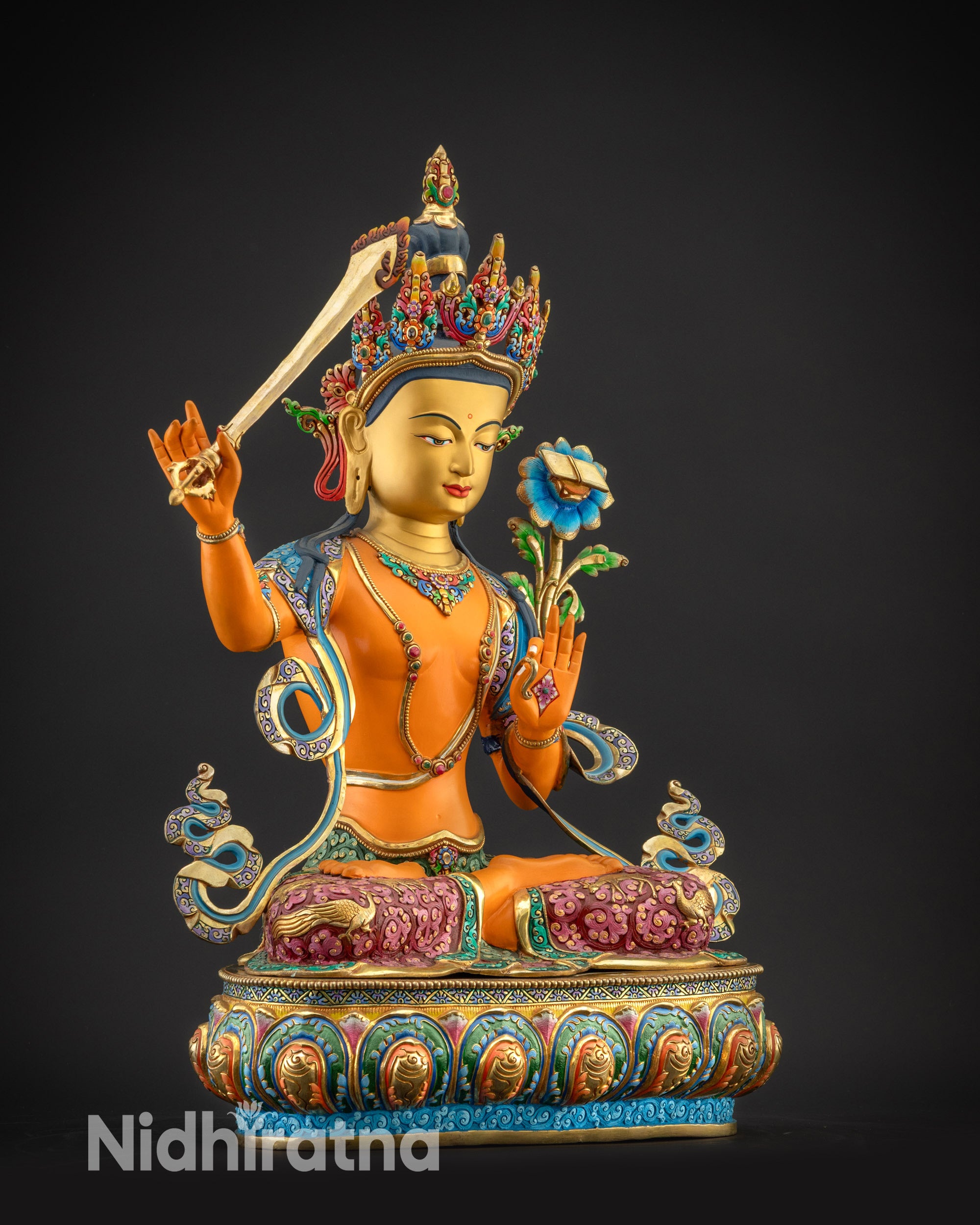 Regular side right of Manjushri statue showing meditative posture and gold robes
