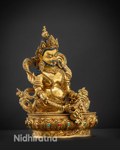 Regular side right view of Dzambhala statue showing right hand and flowing robes
