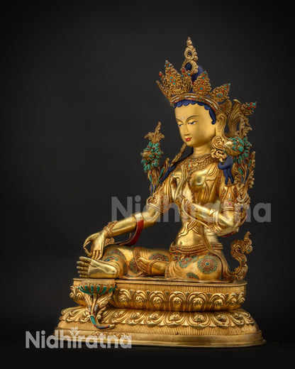 Regular side right view of Green Tara statue with gold fire-gilded ornaments