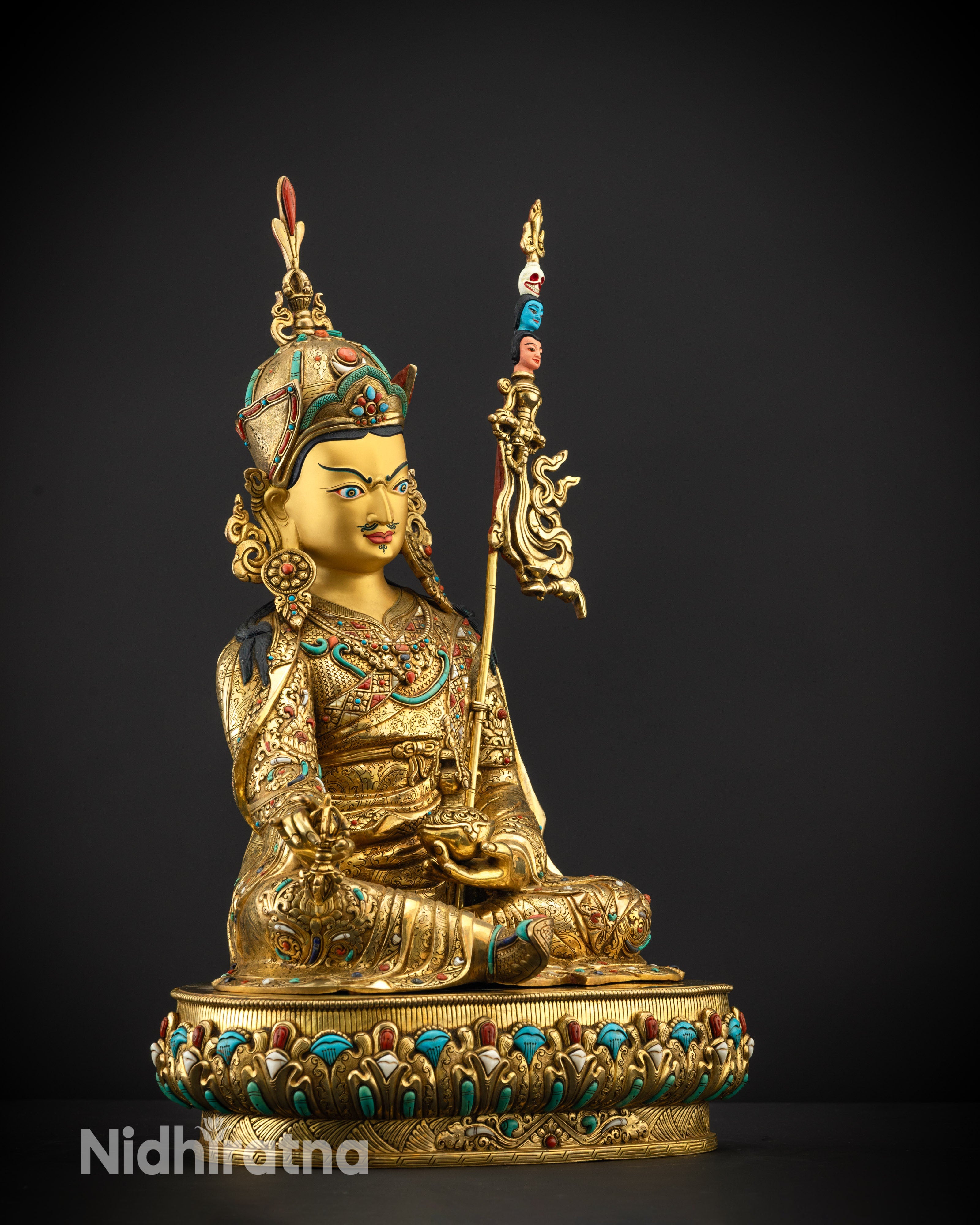 Regular side right view of Guru Rinpoche statue with lotus base and gilded finish

