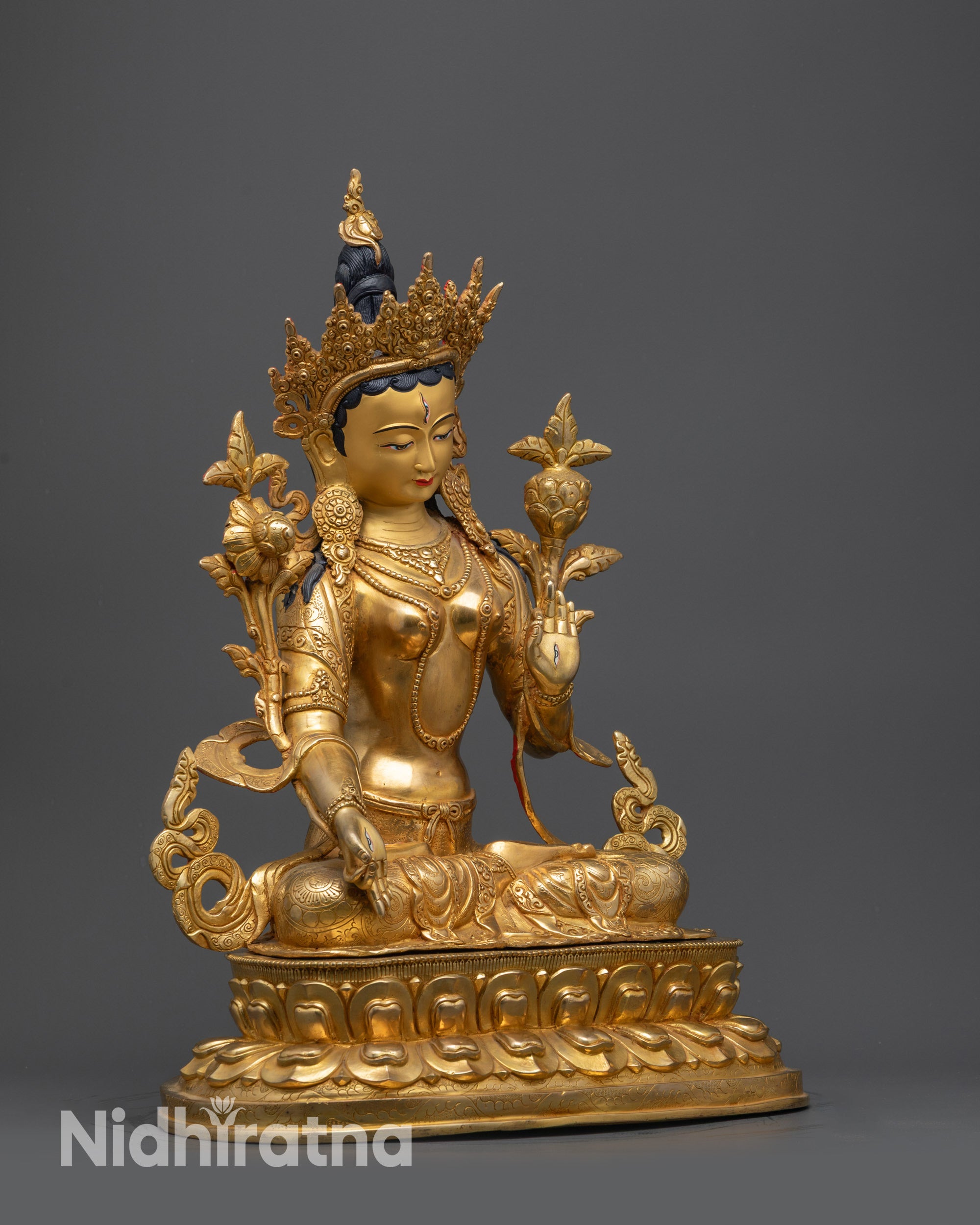 Regular side right view of White Tara seated on lotus with flowing robe
