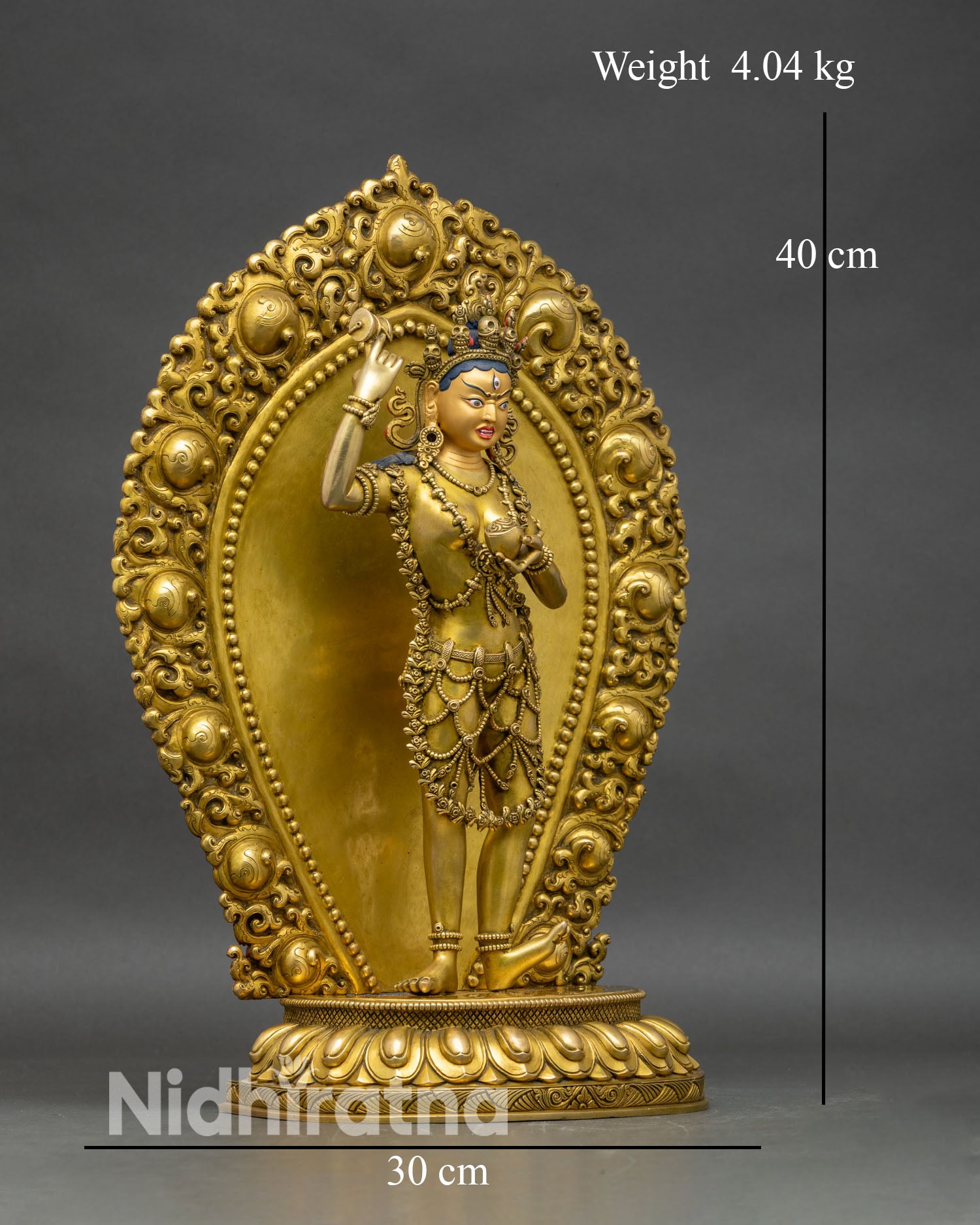 Right profile of Achi Chokyi Drolma figurine, adorned with flower garland and jewelry