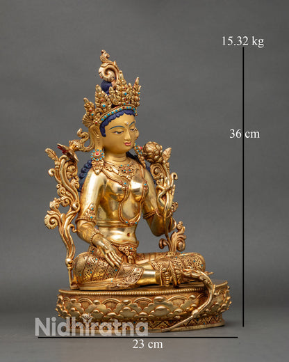 Right profile of Green Tara statue, copper and gold, traditional Nepalese art