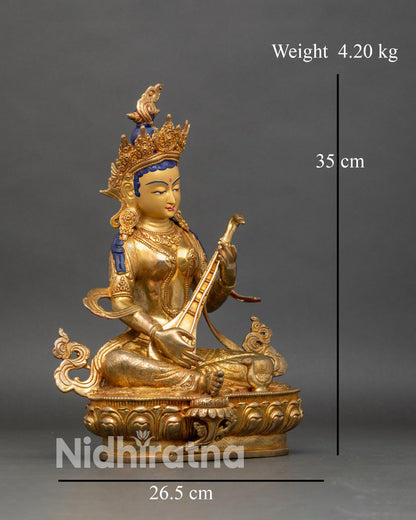 Right profile of Saraswati statue holding veena, handcrafted copper gilded Nepal art