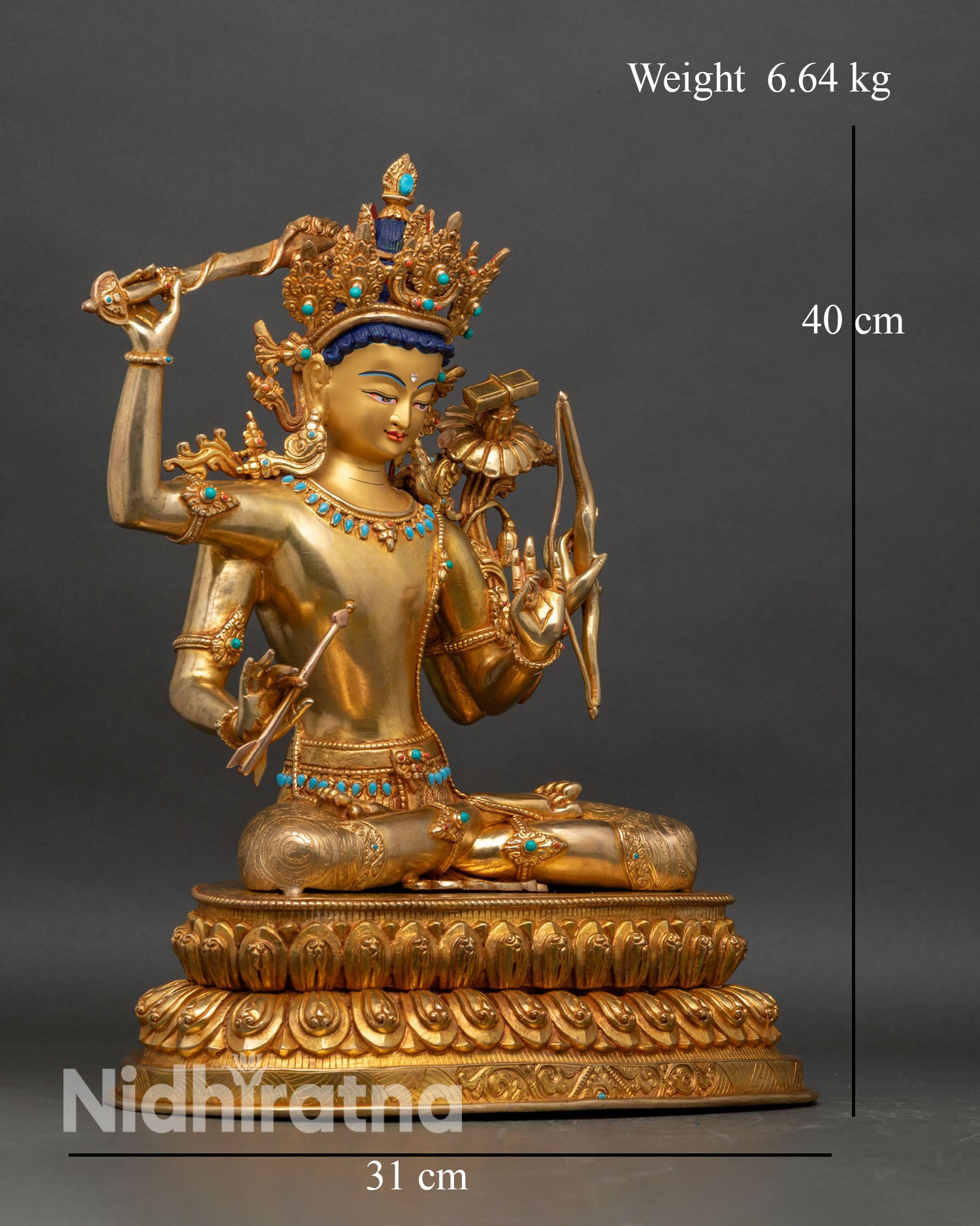 Right profile of Maha Manjushri statue, four arms holding sword, bow and lotus in gold finish