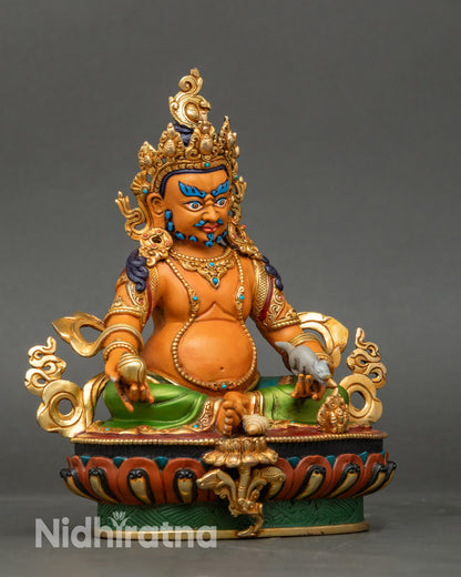 Right-side view of Dzambhala statue holding bijapuraka and jewel-spitting mongoose