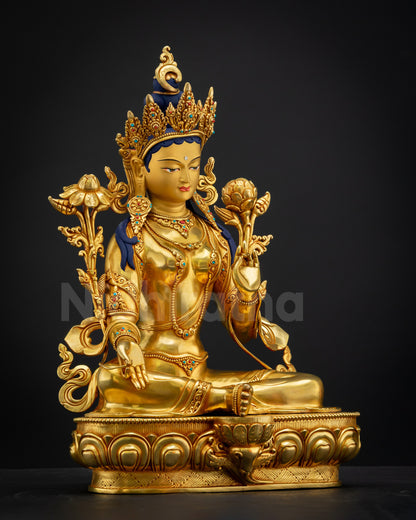 Right-side view of Green Tara statue in Lalitasana posture on lotus throne with utpala flowers, Nepalese sacred artwork