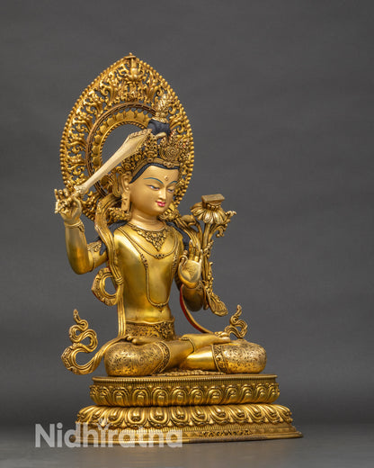 Right-side view of Manjushri statue holding utpala flower and wisdom sword